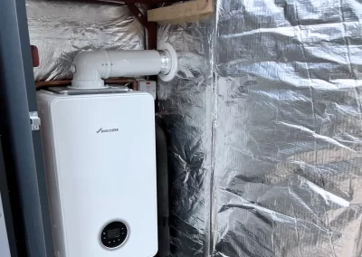 White Worcester Bosch Boiler in a metal case with insulation