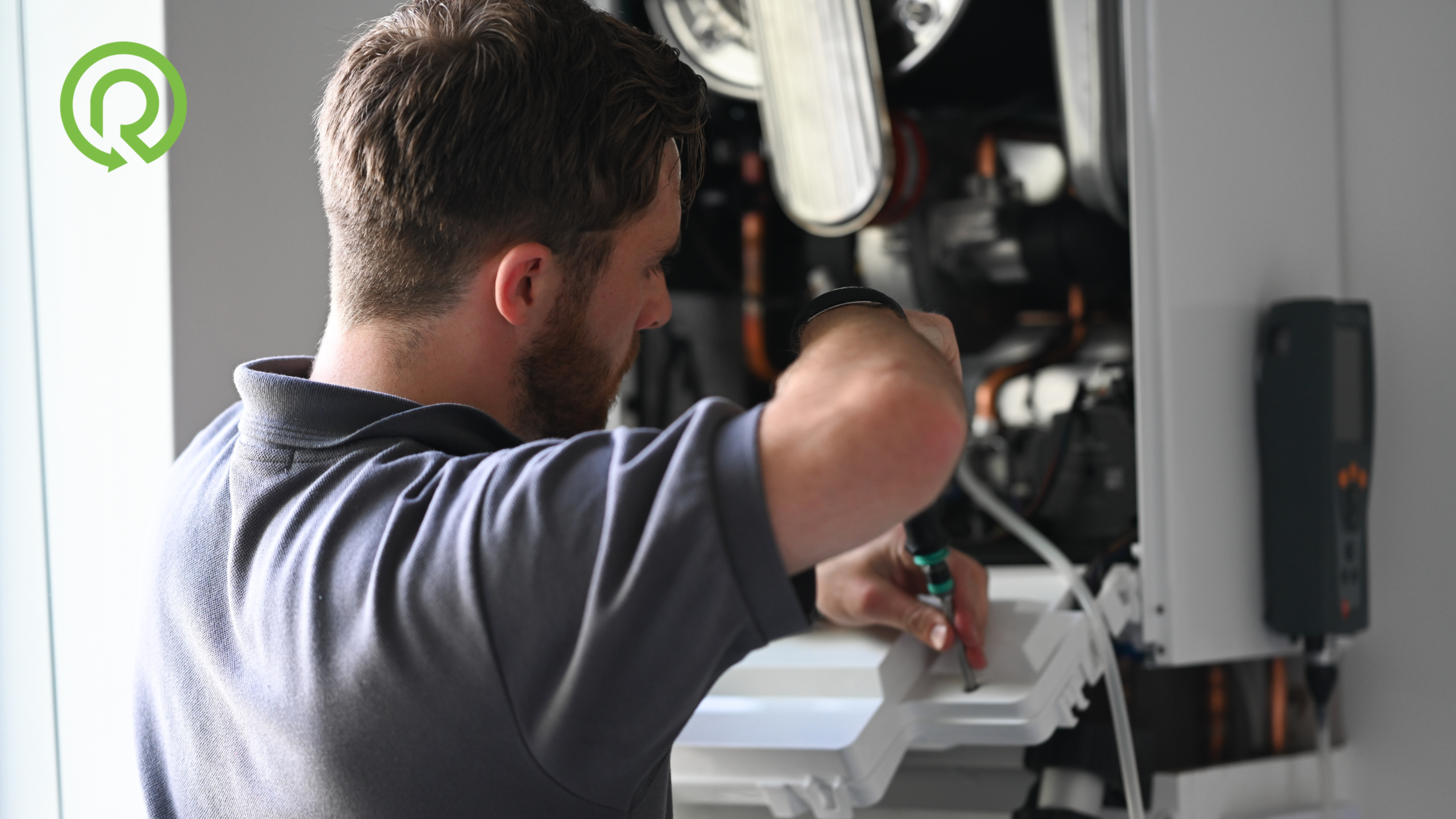 Boiler Replacement & Servicing (4) Image of a Refresh NI engineer servicing a boiler